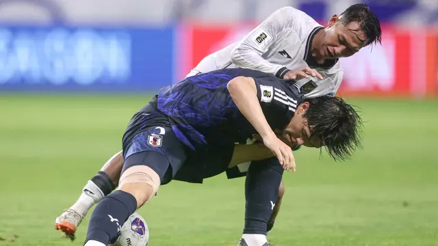 Sempat memberikan perlawanan sengit, Timnas Indonesia akhirnya tertinggal jauh dari Jepang. (PAUL MILLER/AFP)
