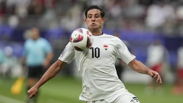 Pemain Irak, Mohanad Ali Kadhim. (AP Photo/Thanassis Stavrakis)